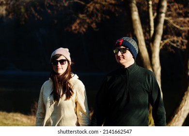 Couple In Pound At Early Spring Park.