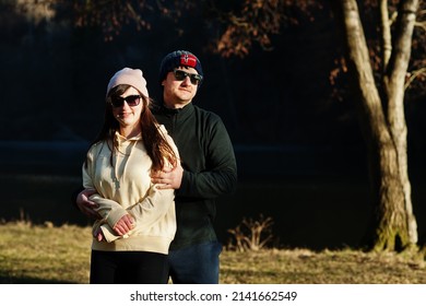 Couple In Pound At Early Spring Park.