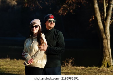 Couple In Pound At Early Spring Park.