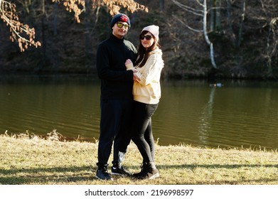 Couple In Pound At Early Spring Park.