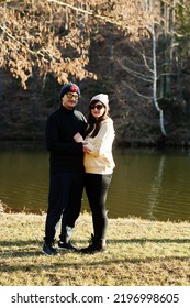 Couple In Pound At Early Spring Park.