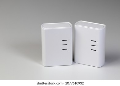 The couple of powerline adaptors, device for support ethernet through power line by Extend network through the electrical wiring, networking hardware devices isolated on white background. 
				