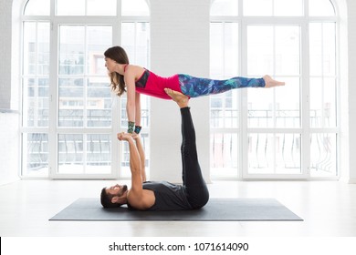 Couple Practicing Acro Yoga Poses Studio Stock Photo (Edit Now) 1071614090