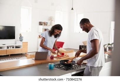 Couple Preparing Meal Together In Modern Kitchen - Powered by Shutterstock