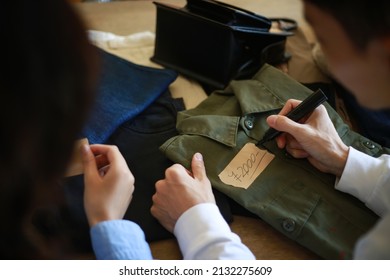 A Couple Preparing To Sell At A Flea Market 