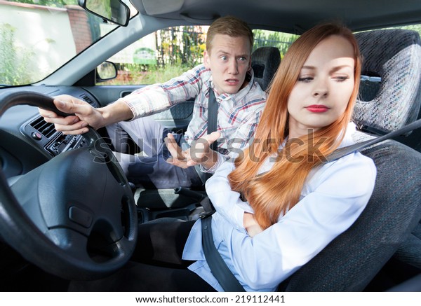 Couple with problems
in a car, horizontal