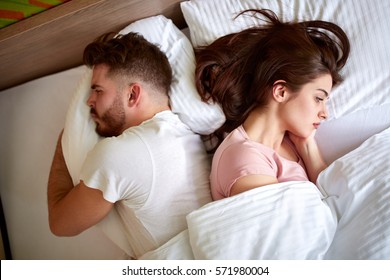 Couple With Problems In Relationship In Bed  