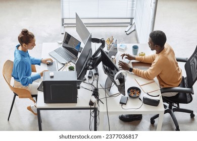 Couple of programmers typing codes on computers - Powered by Shutterstock