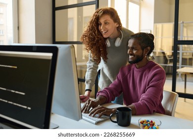 Couple of programmers working in team - Powered by Shutterstock