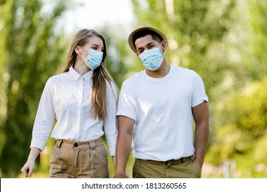 Couple With Protective Mask Walking In The Park