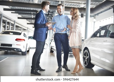 Couple Purchasing Brand New Car 
