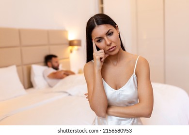 Couple Quarreling Due To Jealousy In Relationship At Home, Young Couple With Relationship Problem Appear Depressed And Frustrated.