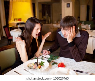 couple quarrels at restaurant and girl screams at the guy