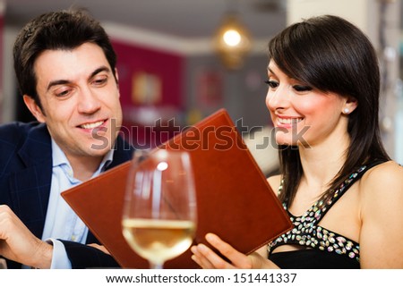 Couple reading menu in a restaurant