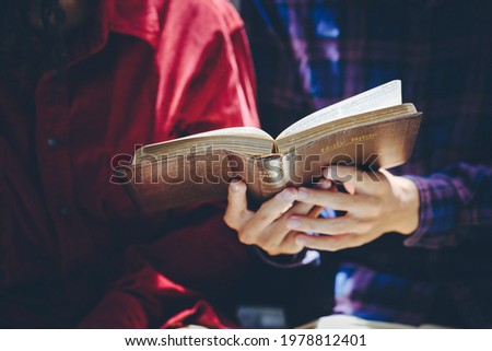 A couple  reading and study bible in home and pray together.Christian concept.