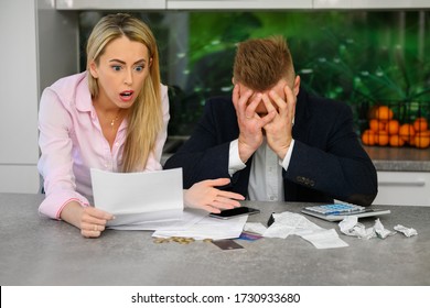 Couple Reading Terrible News Regarding Their Finances