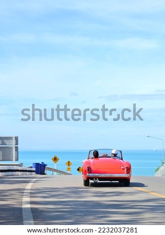 couple in red car on Valentine's Day