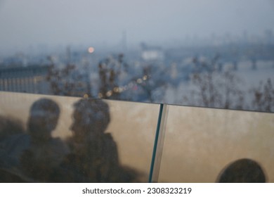 Couple in the reflection. Highview. Bridge. Sunset.