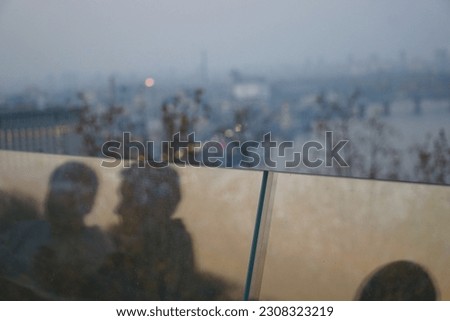 Couple in the reflection. Highview. Bridge. Sunset.