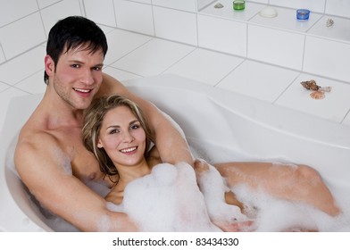 Couple relaxing in the bathtub