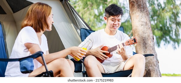 Couple Relaxing Camping. Happy Holiday On The Beach. Young Couple Camping And Resting