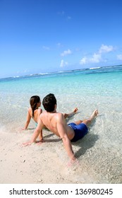 Couple Relaxing In Carribean Sea Water