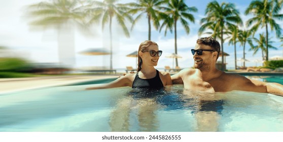 couple relaxing in hot tub by swimming pool at tropical resort. banner with copy space - Powered by Shutterstock