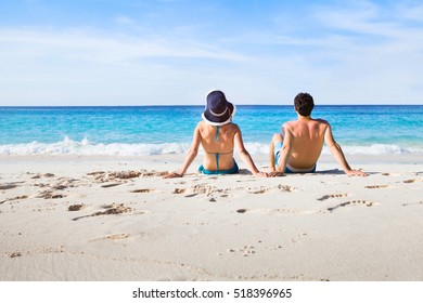 couple relaxing on paradise beach