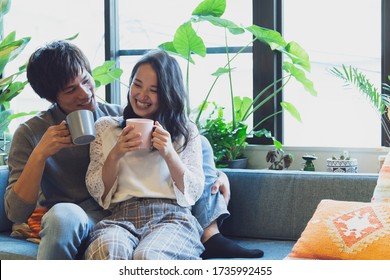 Couple Relaxing On The Sofa