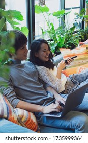 Couple Relaxing On The Sofa