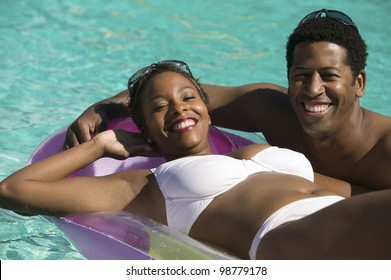 Couple Relaxing in Swimming Pool