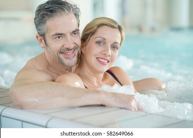 Couple Relaxing In Thalassotherapy Hot Tub