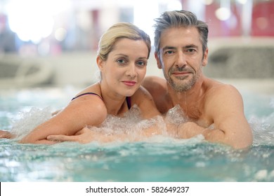 Couple Relaxing In Thalassotherapy Hot Tub