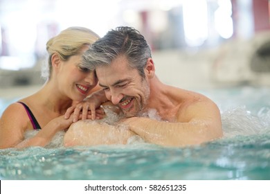 Couple Relaxing In Thalassotherapy Hot Tub