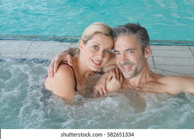 Couple Relaxing In Thalassotherapy Hot Tub