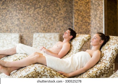 Couple Relaxing In The Thermal Suite At The Spa