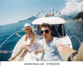 Couple resting on a yacht at sea. Luxury holiday vacation.