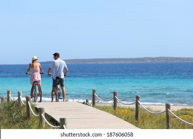 Couple riding bikes on Formentera Island