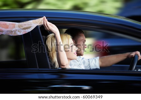 Couple riding in a car at high speed
