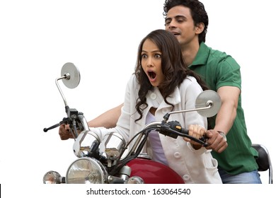 Couple Riding A Motorcycle