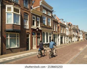 couple riding on bicycle. Love, relationship, romance concept. Young couple riding bicycle through the streets. back view. UTRECHT, NETHERLANDS - Powered by Shutterstock