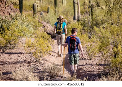 Couple Rugged Desert Hiking In The American Southwest