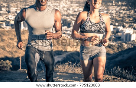 Couple running in los angeles canyons