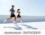 Couple Running Together on a Sunny Day, Enjoying Outdoor Fitness and Healthy Lifestyle