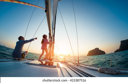 Couple Sailing In The Tropical Sea