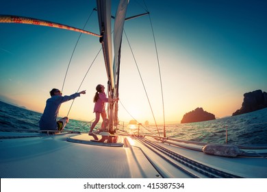 Couple Sailing In The Tropical Sea