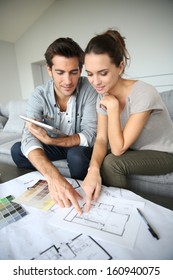 Couple Searching Ideas To Decorate New Home