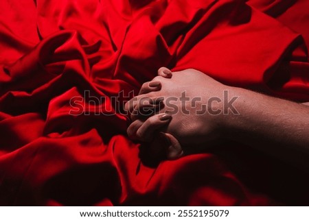 Couple sensual touch. Hands of lovers. Woman pulling sheets. Hands of love. Couple in love. Sensual hands concept. Tender couple in bed. Romance.