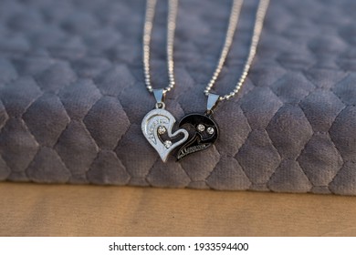 Couple Set Pendant Necklace Half Of Heart Shoot Outdoors In A Sunny Day Closeup. Selective Focus