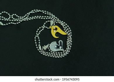Couple Set Pendant Necklace Half Of Heart Gold And Sliver Color Shoot Closeup. Selective Focus